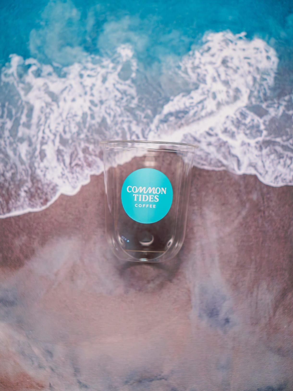 Common Tides Coffee branded compostable cup of craft coffee in Wilmington NC